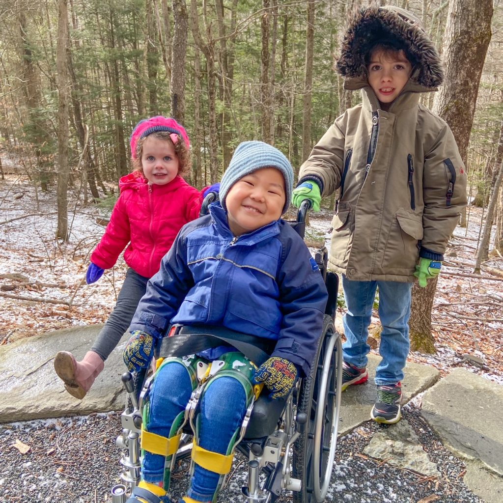 kids on trail with wheelchair