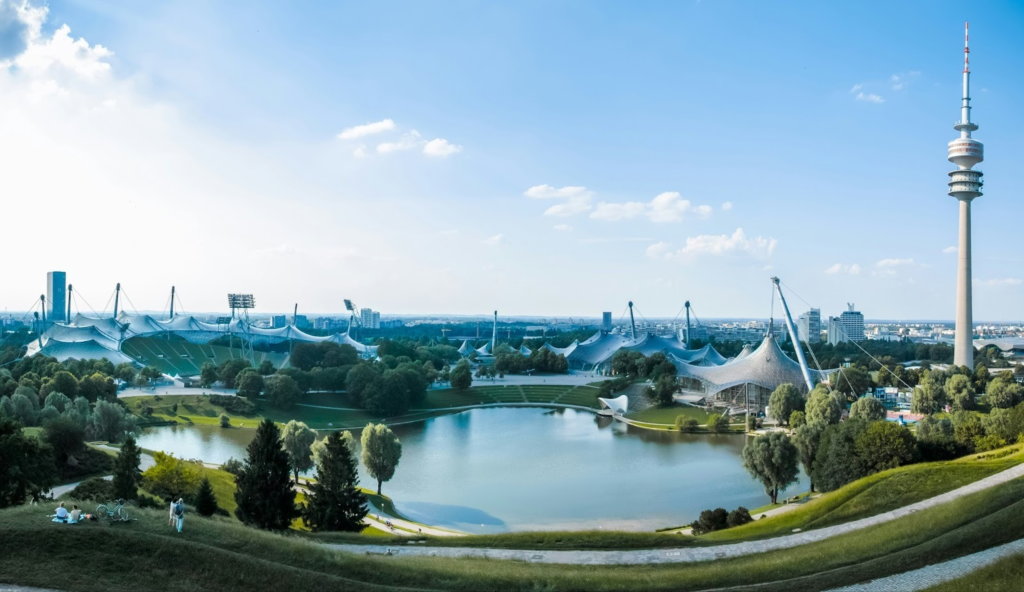 White event tents around blue water. Cityscape in background.
https://unsplash.com/photos/white-and-blue-boats-on-water-during-daytime-Uk8rcwYU4bY
