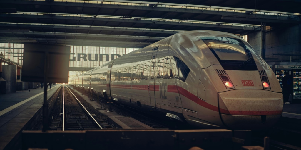 Modern white train in station.
https://unsplash.com/photos/a-high-speed-train-arrives-at-the-station-xto0D2c7QQc?utm_content=creditShareLink&utm_medium=referral&utm_source=unsplash