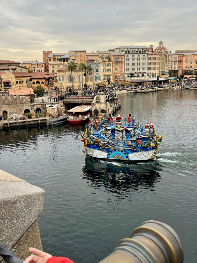 boat parade float with Mickey, Minnie, and Santa in Christmas outfits