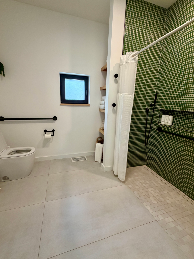 green tiled roll in shower