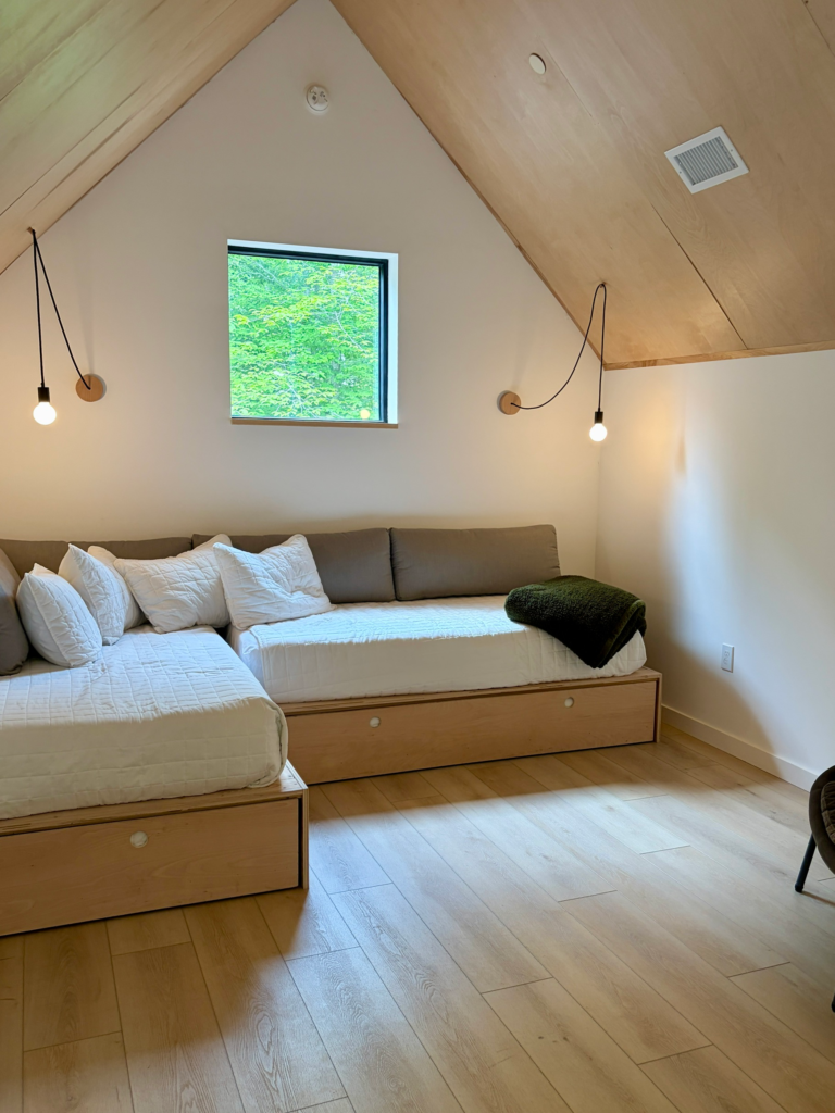 White twin beds with trundles